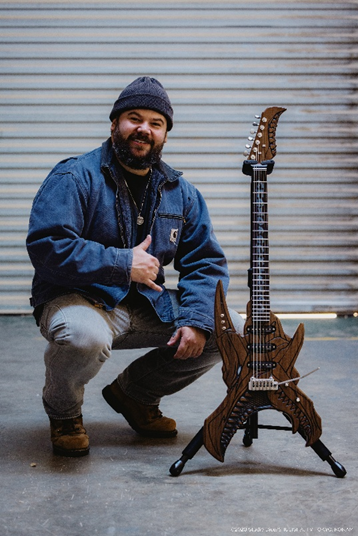 Bear Walker proudly displays his Yu-Gi-Oh! Guitar